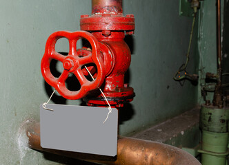 Old rusty control equipment, the old red valve can serve as a relic