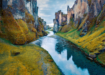 View from flying drone of Fjadrargljufur canyon and river. Wonderful summer scene of South east...