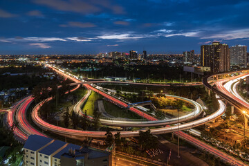 Fototapeta na wymiar Elevated road junction interchange overpass expressway in Bangkok during twilight