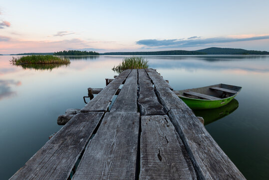 Fototapeta old wooden pier on the lake