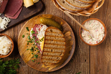 Ruben sandwich. New York sandwich with pastrami, sauce 1000 islands and sauerkraut.