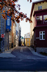 Romantic backstreet, side street or alley in historic old town of Quebec City, Canada with French...