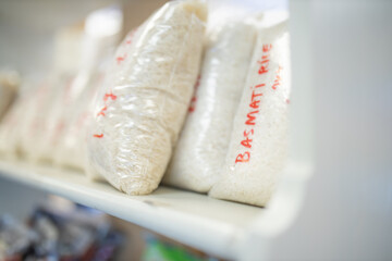Basmati Rice Packed in Plastic Bags and on a Shelf Ready for Sale