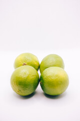 Real limes on white background