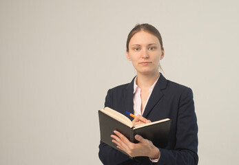 Obraz premium Happy beautiful business woman with clipboard