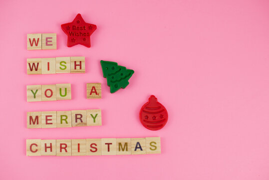 Happy New Year And Merry Christmas. Scrabble Letters, Playdough And Plasticine. Letter Tiles Spelling Celebration Holiday.