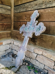 old wooden cross with the image of Christ at the old church