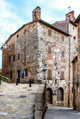 Fototapeta na wymiar Palazzo Pretorio, a medieval building erected in the 13th century and ornated with coats of arms of noble families, nowadays town hall of Campiglia Marittima, Province of Livorno, Tuscany, Italy