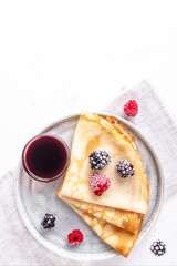 Crepe with  berries. Top view, text space