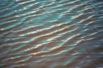 Water reflecting orange from the sun
