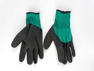 gloves in an assortment of construction gloves for a garden and a vegetable garden on a white background