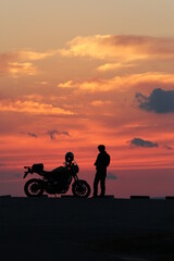 Fototapeta na wymiar Rider with the setting sun in the background