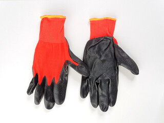 gloves in an assortment of construction gloves for a garden and a vegetable garden on a white background