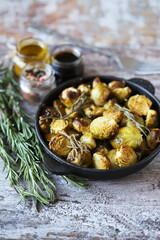 Roasted Brussels sprouts in a cast iron skillet. Healthy food. Vegan lunch. Selective focus. Soft focus.
