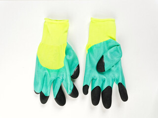gloves in an assortment of construction gloves for a garden and a vegetable garden on a white background