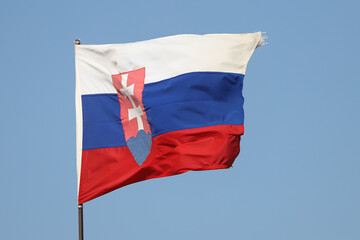 Naklejka na ściany i meble Slovakian flag flying on flagpole