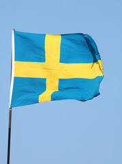 Swedish flag flying on flagpole
