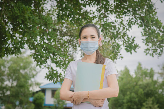 Asian Women Wear Medical Mask Protect Coronavirus Covid 19 And Holding Notebook For Study University