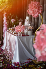 A candy bar with sweets in pink tones.