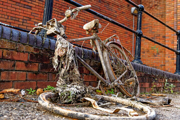 Rusty old bike taking out from a canal