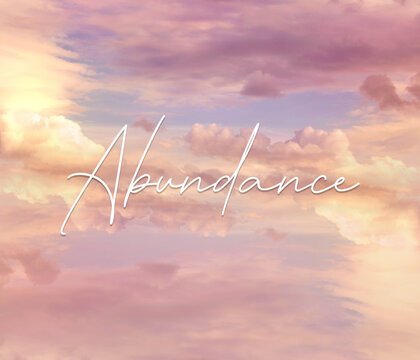 An inspirational template for social media with a beautiful colorful sky with clouds and a handwriting font saying Abundance.