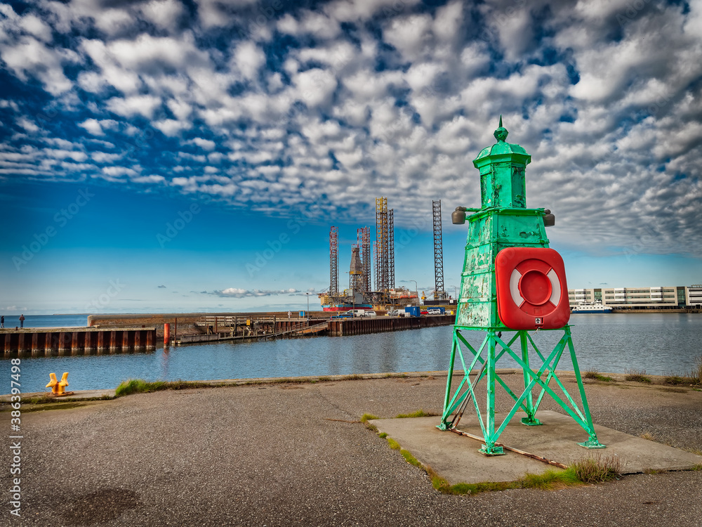 Wall mural Retro lighthouse at the entrance to Esbjerg harbor, Denmark