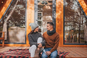 Happy family of two on the terrace in autumn