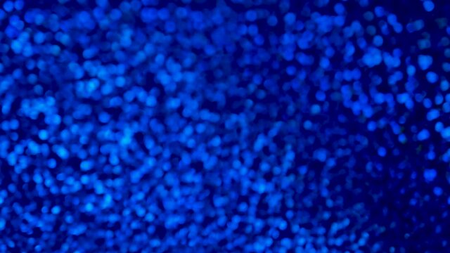 Blue Sequins texture background. 4k resolution video. Beautiful shiny navy background of shiny sequins.