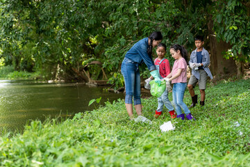 Group student Charity and recycle plastic for environment.  People asia girl  and boy collecting...