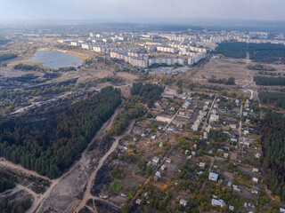 Fototapeta na wymiar Aerial pfoto with drone of destroyed houses after the fire in Ukraine