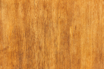 Texture of lacquered wood planks painted in brown.