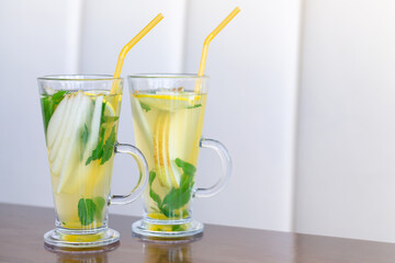 Glass cups of fruit tea on wooden table