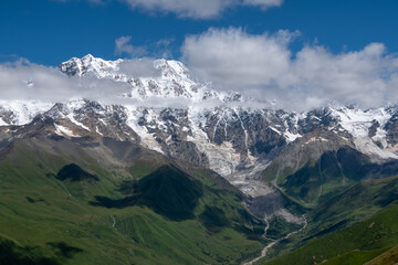 Fototapeta na wymiar View from village Ushguli on Bezengi wall in Greater Caucasus with majestic snow-white peaks, Upper Svaneti, Caucasus