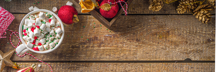 Hot chocolate with marshmallows, warm chocolate drink for Christmas morning breakfast, on wooden...