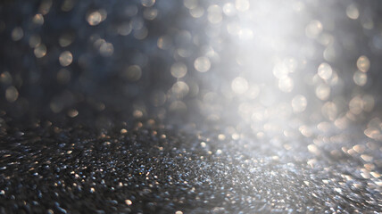 Dark blurred abstract background, bokeh. A flash of blurry lights. Reflection of city lights on the asphalt. Dark Christmas background.