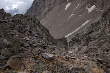 Mountain pass. View of the mountain slopes. Mountain pass Koshtan (3513 meters above sea level). Caucasus, Russia.