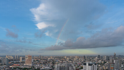 Obraz premium Aerial view of Bangkok Thailand skyline, on blue sky. There are clouds and rainbows, with copy space.