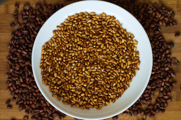 Cedar nut kernels, cedar nut shells. Cedar nut on wooden background.