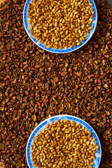 Cedar nut kernels, cedar nut shells. Cedar nut on wooden background.