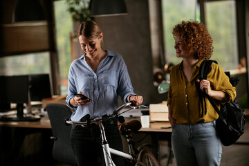 Colleagues in office talking and having fun. Friends working together.