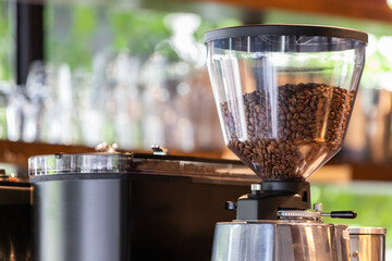 coffee bean in grinder hopper of machine.