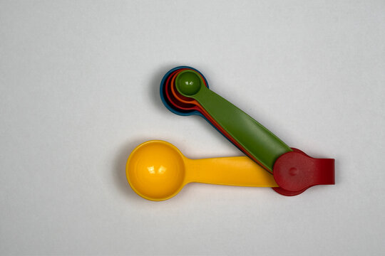 Measuring spoons, several sizes of spoons in the same set, top view of measuring spoons, 1 Tbsp, 1/2 Tbsp, 1 Tsp, 1/2 Tsp, 1/4 Tsp.