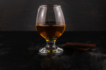 A glass of cognac and dark chocolate