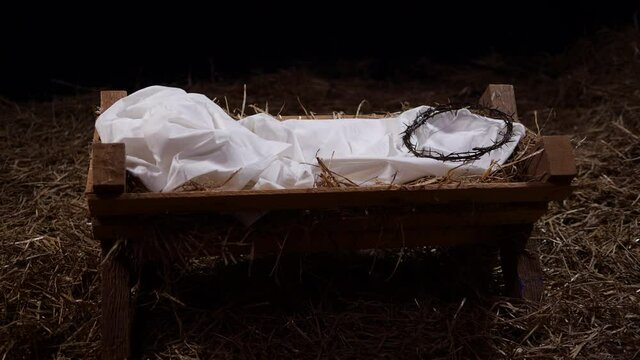 4K Dolly: Crown of Thorns laying in a Manger with straw and Hay. Christmas / Easter Scene for the Nativity 
