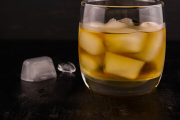 A glass of whiskey on the rocks