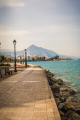 Central street in Xylokastro City with view of the big mountain