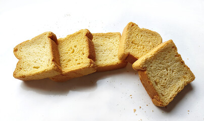 crispy rusk, cake rusk, cardamom rusk, Crunchy or Toast for healthy life, Traditional biscuit tray with tea, toasts for breakfast and cup of fresh milk & Tea, dry toasty bread, crunchy toast, pau, pav