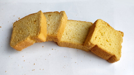 Crunchy Rusk or Toast for healthy life, Traditional biscuit tray with tea, toasts for breakfast and cup of fresh milk & Tea, dry toast bread, crunchy toast, crispy milk rusk, butter roasted bread