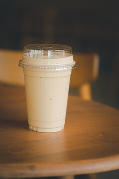 Close up milk coffee smoothie in plastic cup