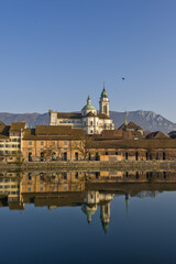 Riverside of Aare and houses dominated by Saint Ursus Cathedral in Solothurn, Switzerland